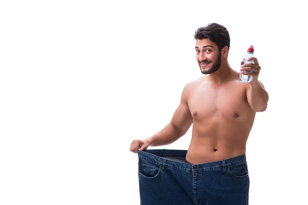 Человек в диете концепции с негабаритными джинсами — стоковое фото