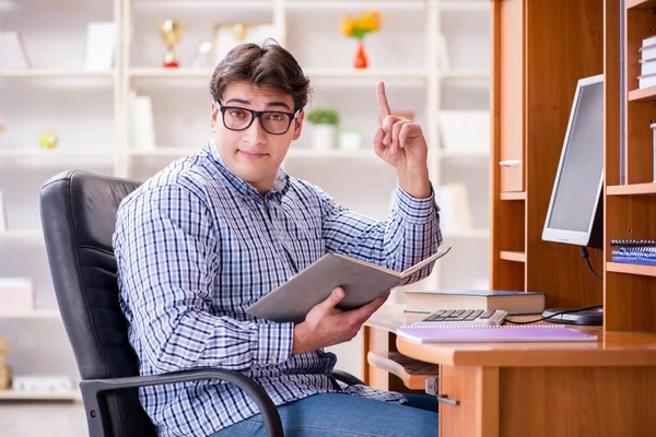 Young student at computer table — Stock Photo, Image