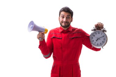 Bir megafon ve üzerinde izole bir çalar saat ile genç tamirci