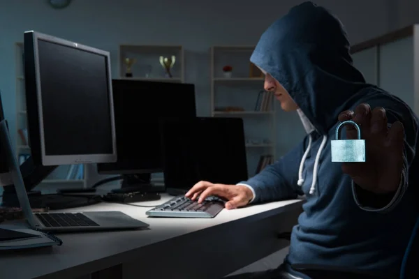 Hacker hacking computer at night