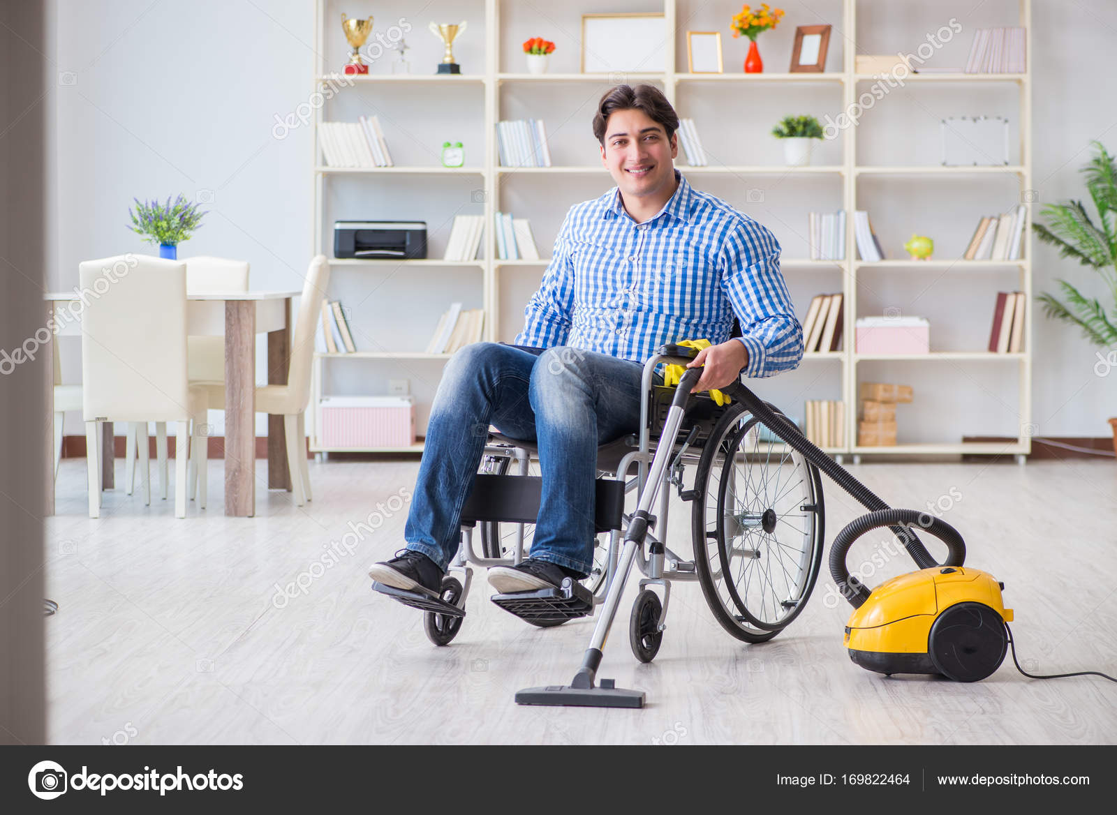 Disabled man cleaning home with vacuum cleaner — Stock Photo © Elnur