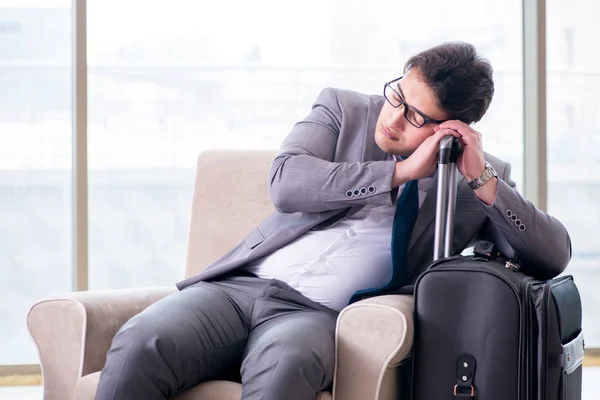 Young businessman in airport business lounge waiting for flight — Stock Photo, Image