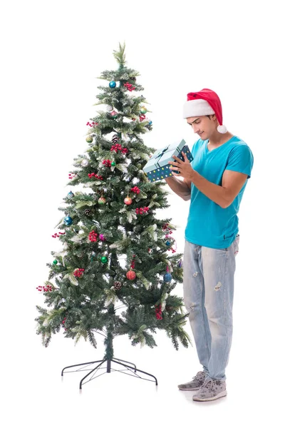 Young man decorating christmas tree isolated on white — Stock Photo, Image