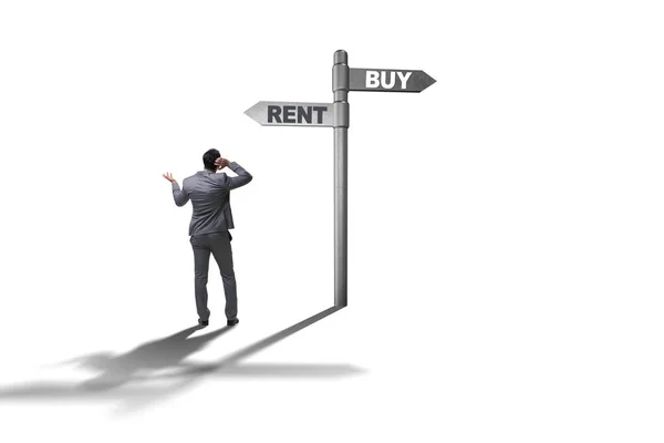 Businessman at crossroads betweem buying and renting on white — Stock Photo, Image