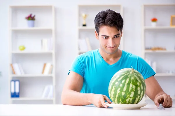 Man eating watermelon at home — Stock Photo, Image