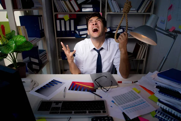 Man businessman working late hours in the office — Stock Photo, Image