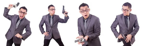 Divertido hombre de negocios con pistola en blanco —  Fotos de Stock