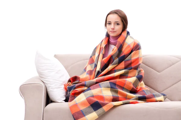 Teenager suffering from cold sitting on coach — Stock Photo, Image