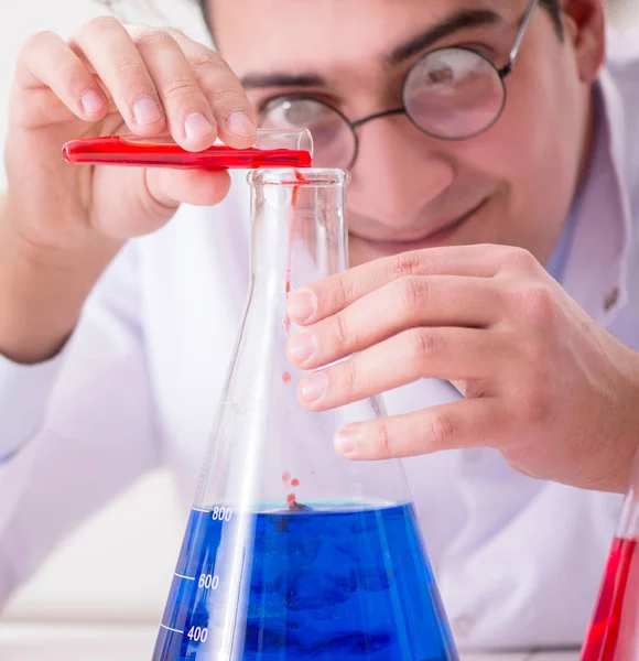 Mad crazy scientist doctor doing experiments in a laboratory — Stock Photo, Image