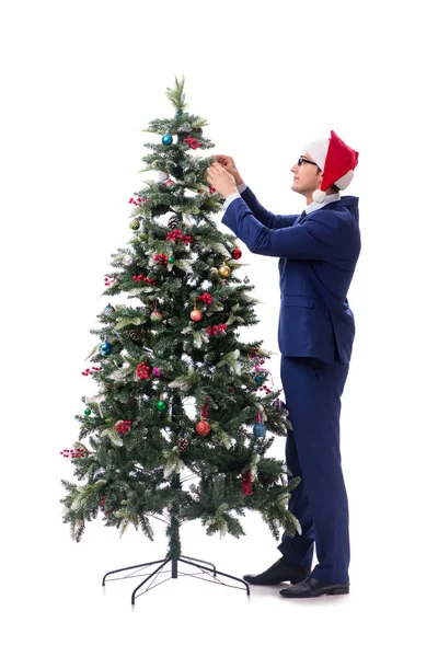 Empresário decorando árvore de Natal isolado em branco — Fotografia de Stock