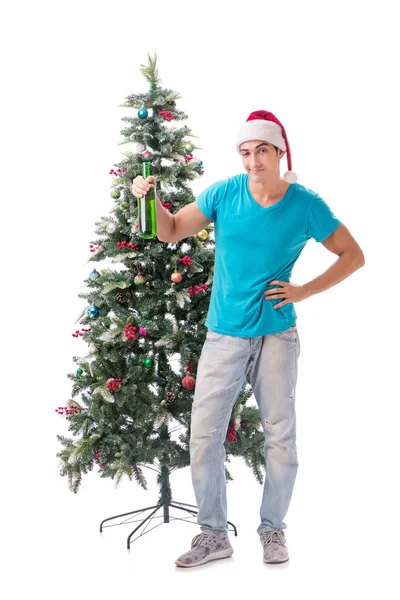 Hombre joven decorando árbol de Navidad aislado en blanco —  Fotos de Stock