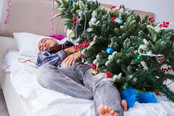 Man suffering hangover after christmas party — Stock Photo, Image