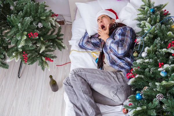 Man suffering hangover after christmas party — Stock Photo, Image