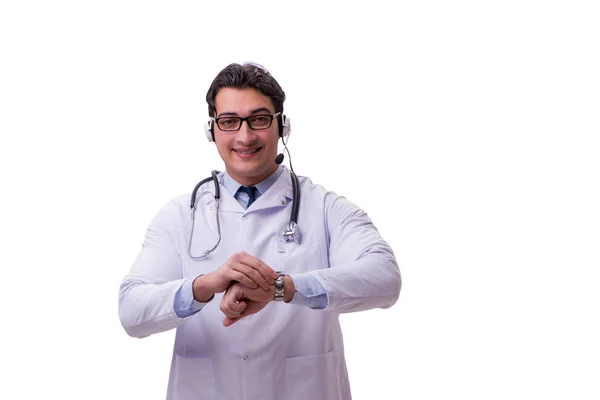 Médico jovem com fone de ouvido isolado em branco — Fotografia de Stock