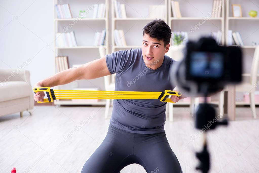 Sports and health blogger recording video in sport concept