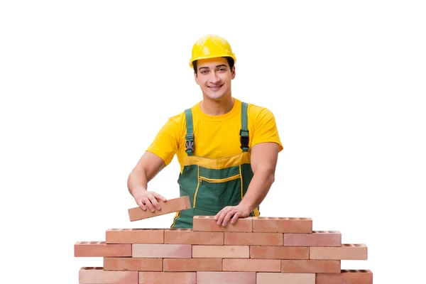 Przystojny budowlaniec buduje ceglany mur — Zdjęcie stockowe
