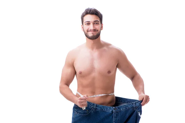 Homem em dieta conceito com jeans de grandes dimensões — Fotografia de Stock