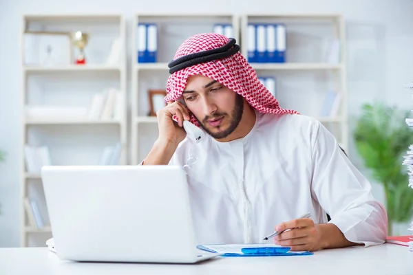 Arab businessman working in the office doing paperwork with a pi — Stock Photo, Image