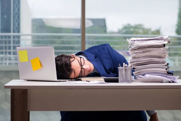 Workaholic businessman overworked with too much work in office — Stock Photo, Image