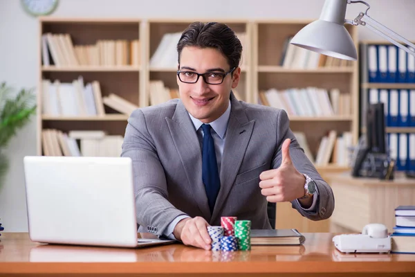 Businessman gambling playing cards at work — Stock Photo, Image