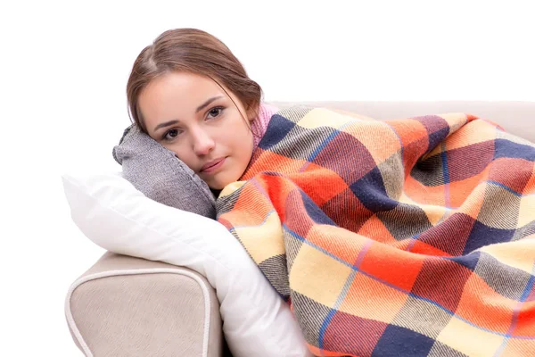 Teenager suffering from cold sitting on coach — Stock Photo, Image