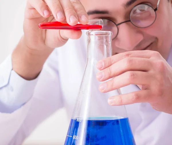 Mad crazy scientist doctor doing experiments in a laboratory — Stock Photo, Image