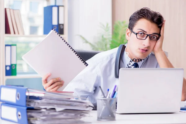 Young businessman under pressure in office to deliver tasks — Stock Photo, Image