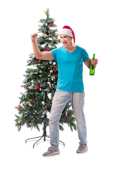 Hombre joven decorando árbol de Navidad aislado en blanco —  Fotos de Stock