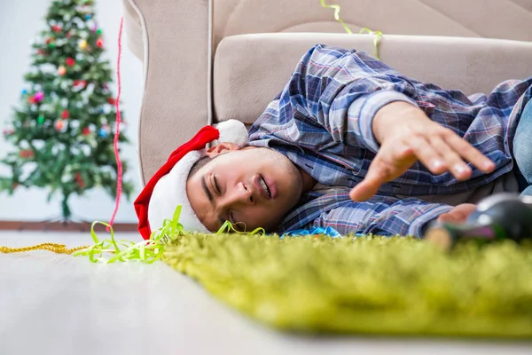 Man having hangover after christmas party — Stock Photo, Image