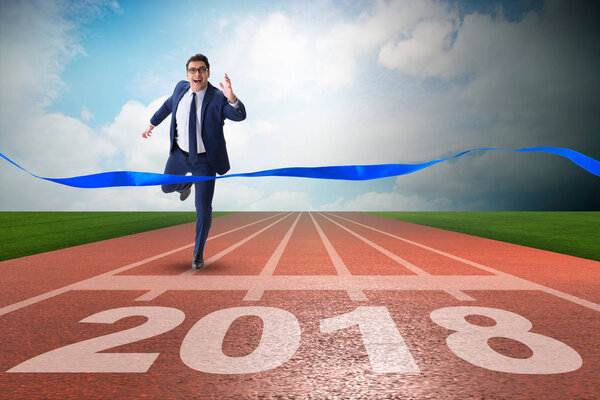 Businessman running towards new year  2018