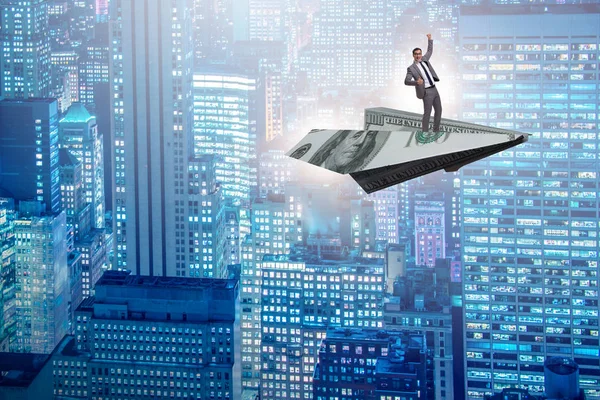 Businessman flying on paper plane in business concept