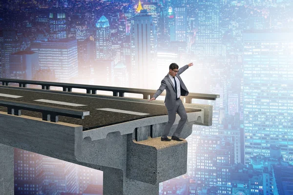Businessman in uncertainty concept with broken bridge — Stock Photo, Image