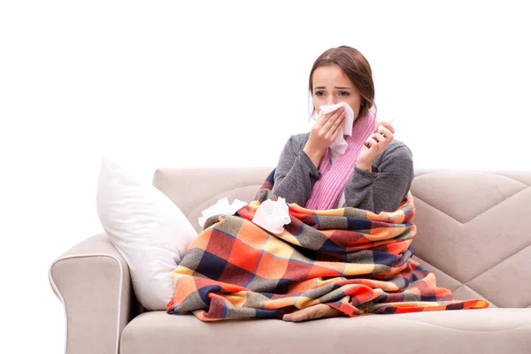 Teenager suffering from cold sitting on coach — Stock Photo, Image