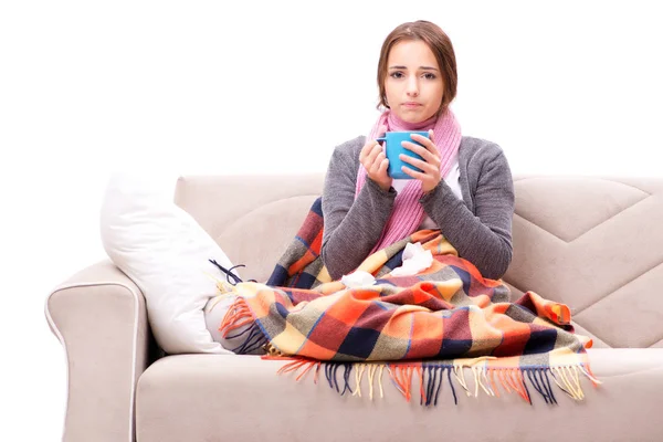 Teenager suffering from cold sitting on coach — Stock Photo, Image