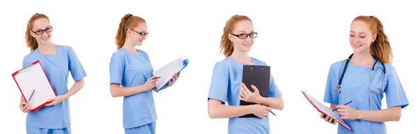 Гарненька лікарка в синій формі з документами ізольовані на білому — стокове фото