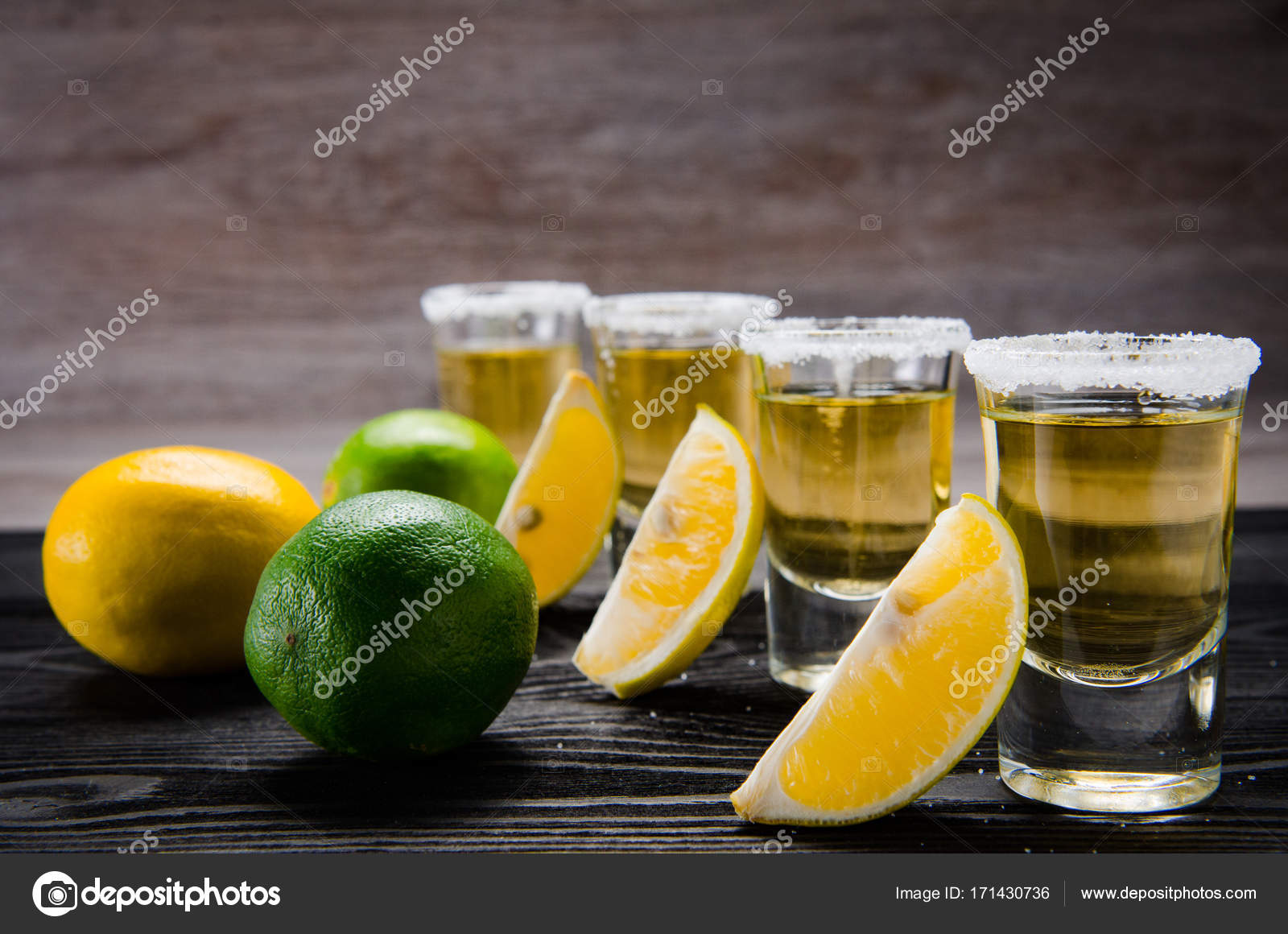Tequila drink served in glasses with lime and salt Stock Photo by