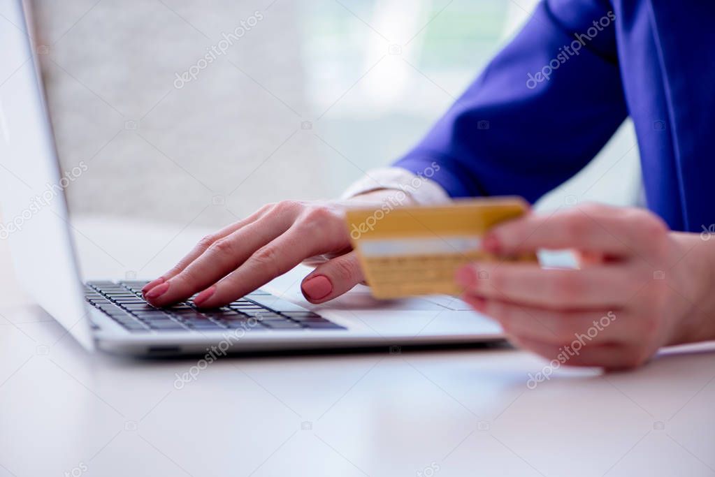 Woman buying online with credit plastic card