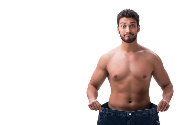 Homem em dieta conceito com jeans de grandes dimensões — Fotografia de Stock