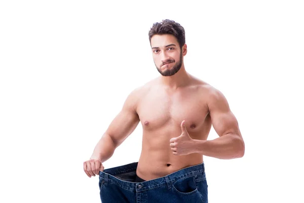 Homem em dieta conceito com jeans de grandes dimensões — Fotografia de Stock