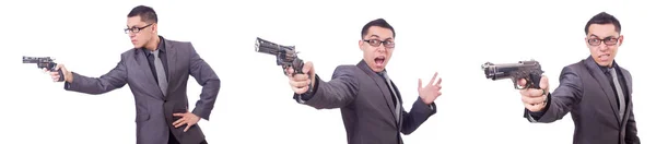 Lustiger Geschäftsmann mit Pistole auf Weiß — Stockfoto