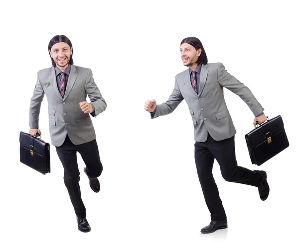 Giovane uomo d'affari in tuta grigia che tiene la valigetta isolata su whi — Foto Stock