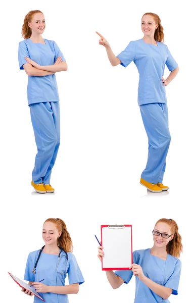 Όμορφη γιατρός με μπλε στολή που απομονώνονται σε λευκό — Φωτογραφία Αρχείου