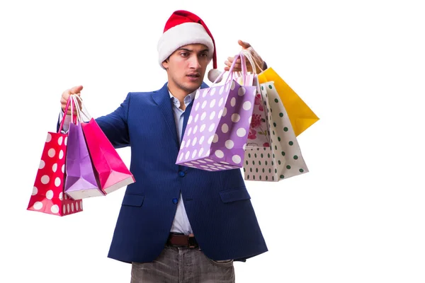 Nuori mies pussit joulun jälkeen ostoksia valkoisella taustalla — kuvapankkivalokuva