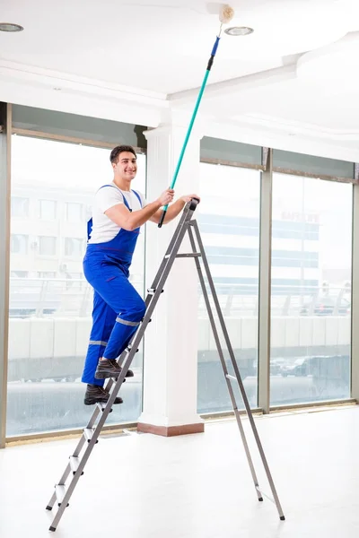 Painter repairman working at construction site — Stock Photo, Image