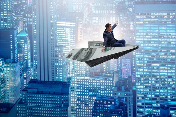 Uomo d'affari che vola su un aereo di carta nel concetto di business — Foto Stock