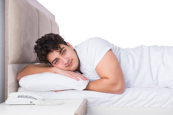 Man in bed suffering from insomnia