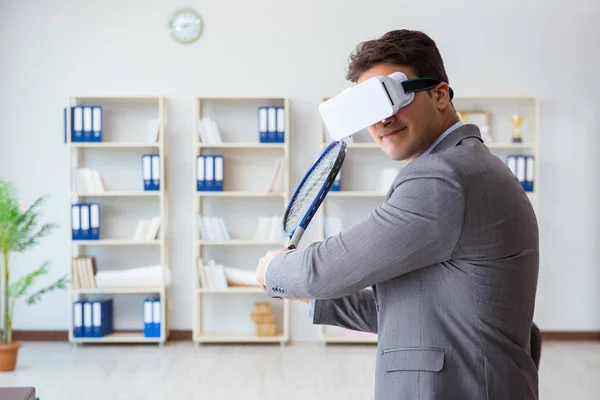 Businessman playing virtual reality tennis in office with VR gog — Stock Photo, Image