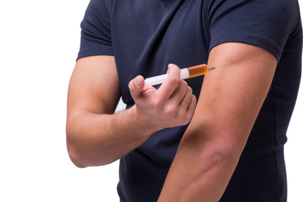 Young man in doping concept isolated on white