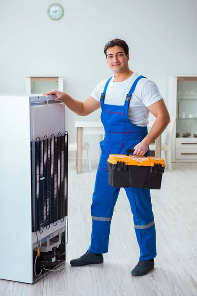Repairman contractor repairing fridge in DIY concept — Stock Photo, Image