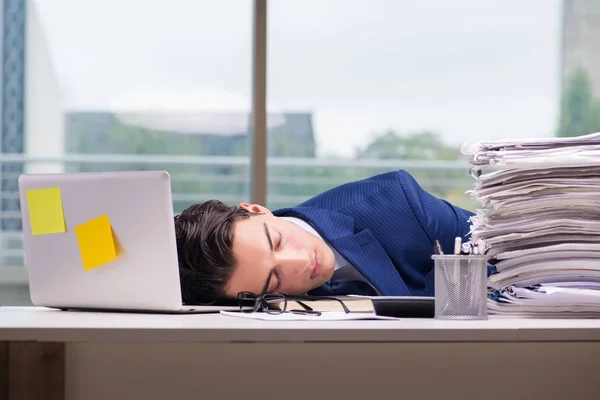 Workaholic businessman overworked with too much work in office — Stock Photo, Image